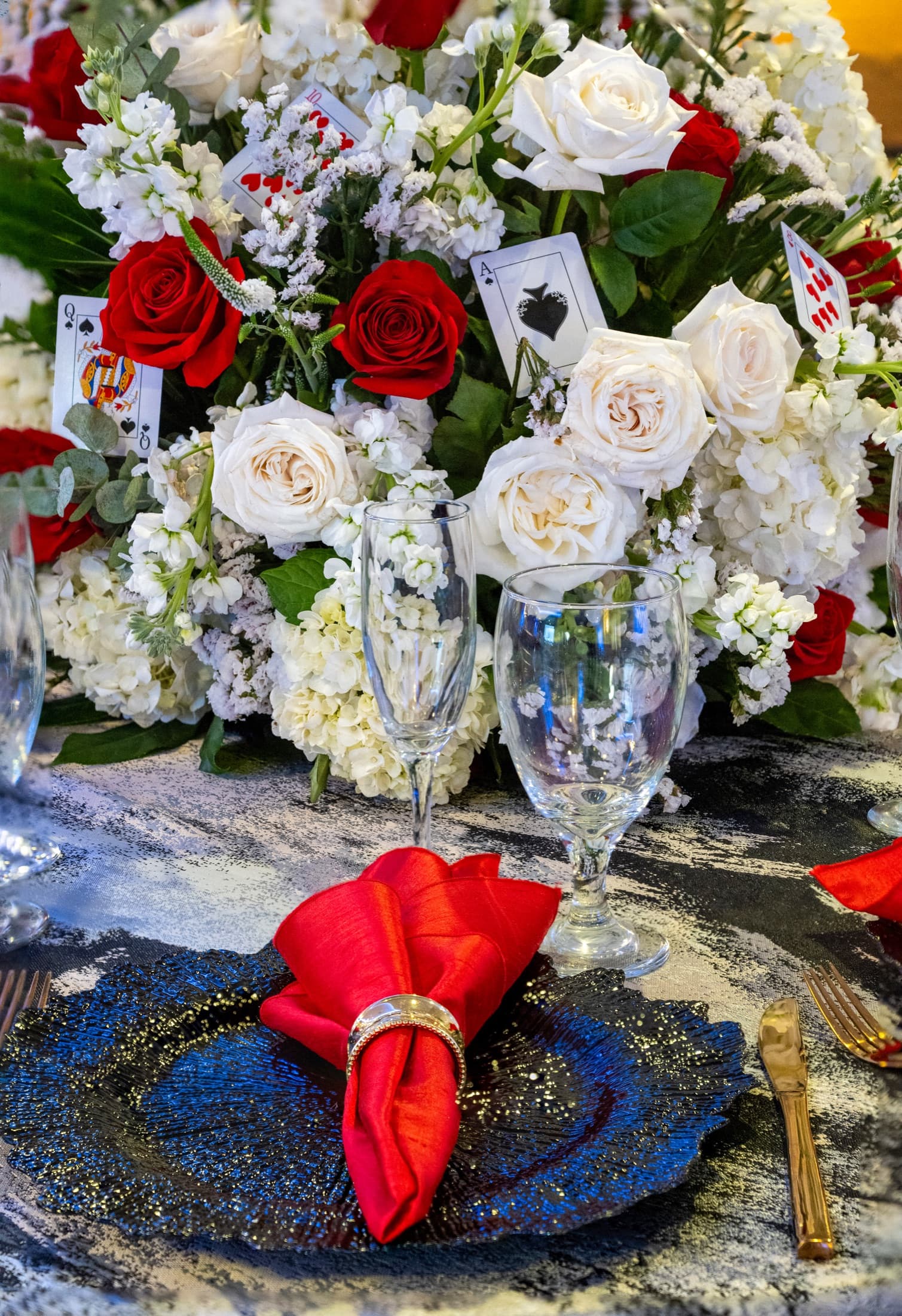 Red and white floral celebration tablescape at La Vie